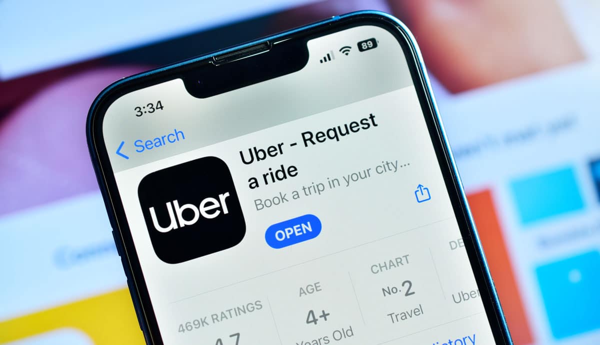 Mobile phone being used to access the ride-hailing app Uber