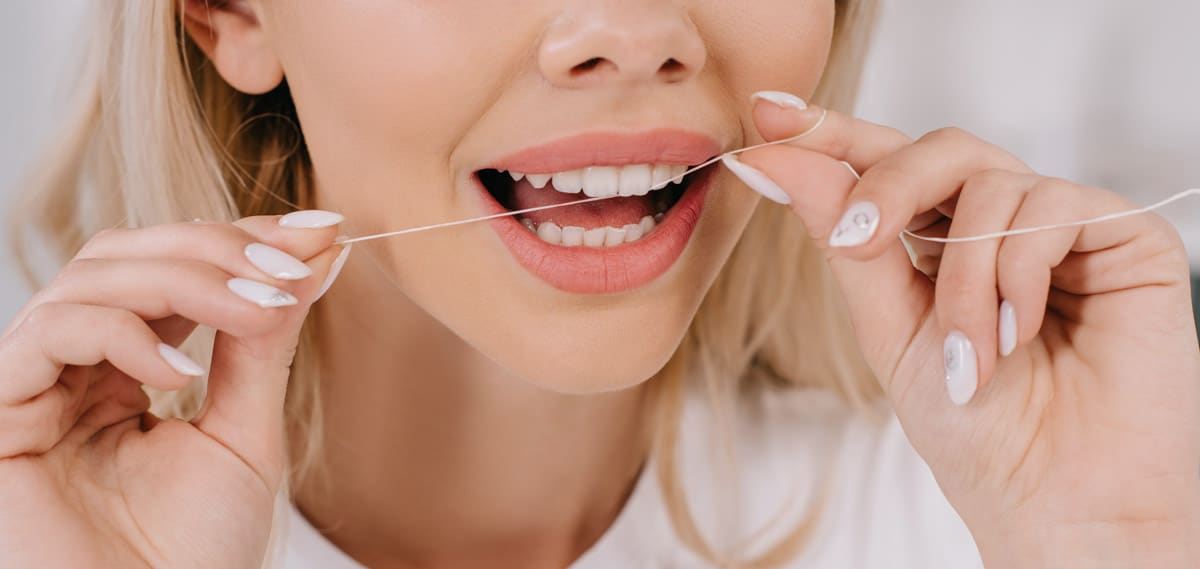 Regular flossing for good dental health
