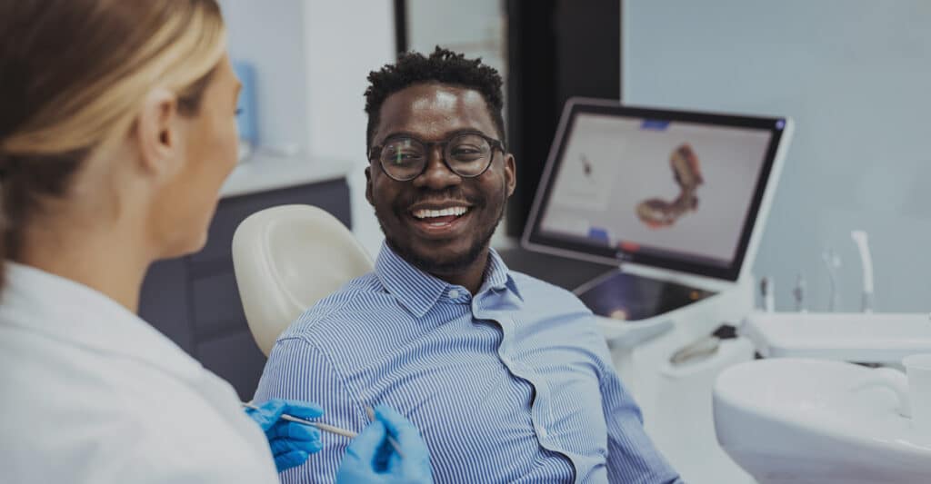 man at dentists good candidate composite veneers