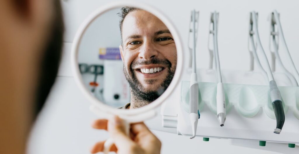 confidence man smiling dentist fulham
