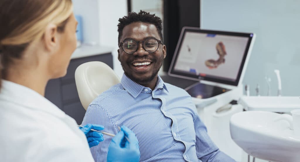 man at dentists choosing teeth whitening fulham