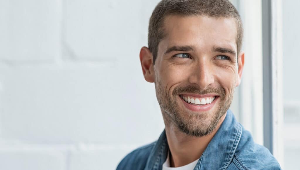man smiling reeplacing teeth oral health maintenance