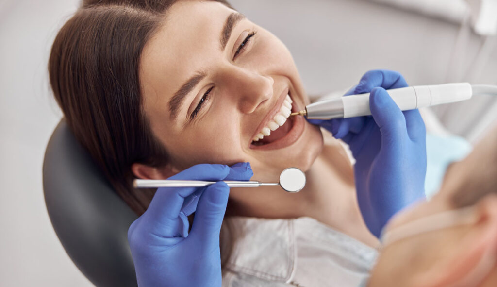woman at dentists cosmetic treatments on dental finance