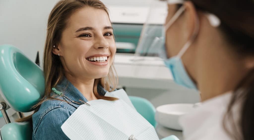 woman at dentists replacing teeth dentists considerations