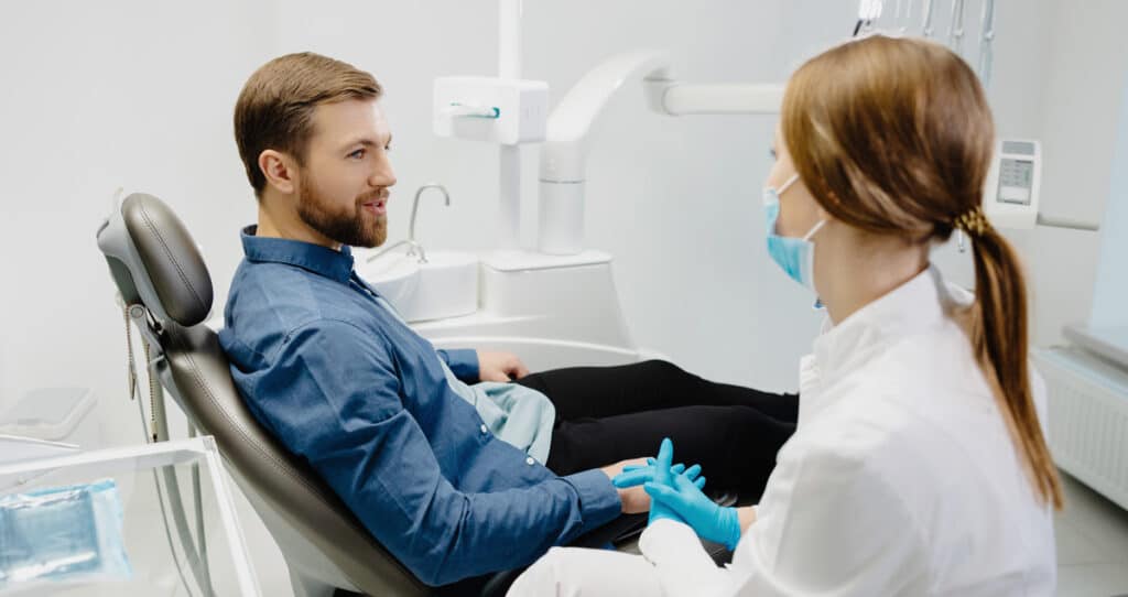 man at dentists immediate emergency dental steps to take