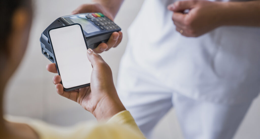 woman paying at dentists finance for root canal procedure
