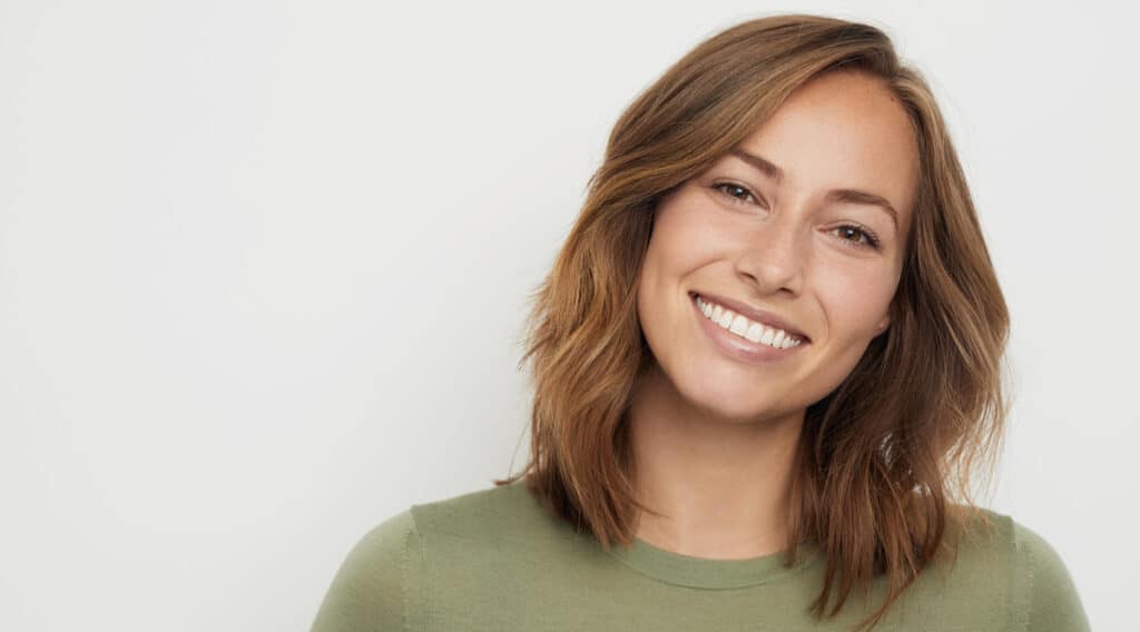 woman smiling oral health habits and how to reduce cavities