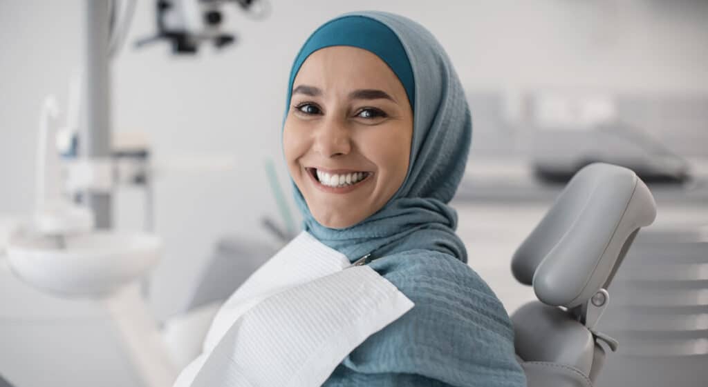 woman at dentists with support for complex treatments with private dental sedation